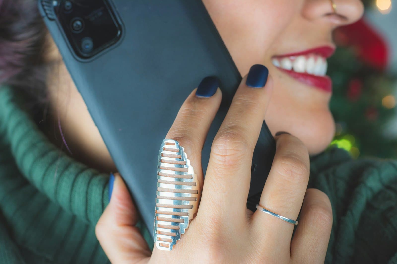 A hand holding a smartphone